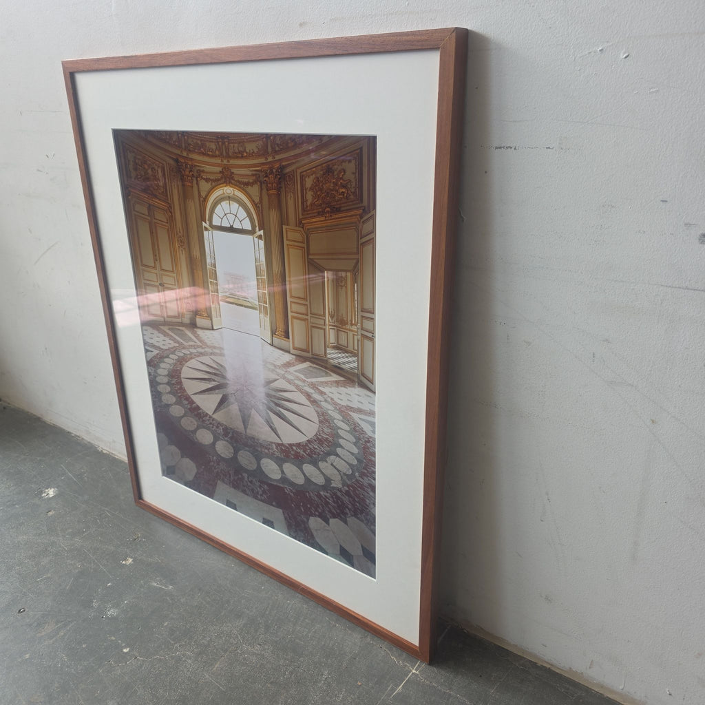 Art print featuring detailed palace architecture, a decorative floor, and classic wooden frame, ready to display.  