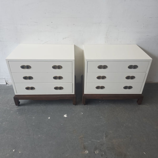 Pair of Henredon end tables with white finish, three drawers, and brass ring pulls in good condition.