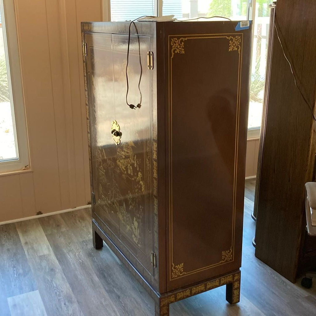 Chinoiserie-style solid wood cabinet by Drexel Heritage, featuring ornate gold detailing and sturdy legs for stylish storage.