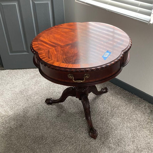 Henkel-Harris mahogany side table with clover-shaped top, single brass-handled drawer, and carved pedestal base.