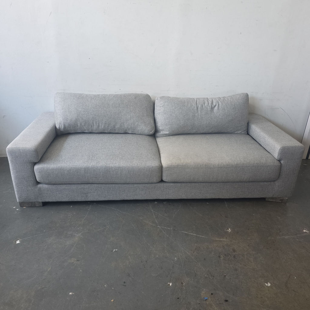 Light gray Ben Soleimani 3-seat sofa with square arms and supportive cushions, shown in gently used condition.
