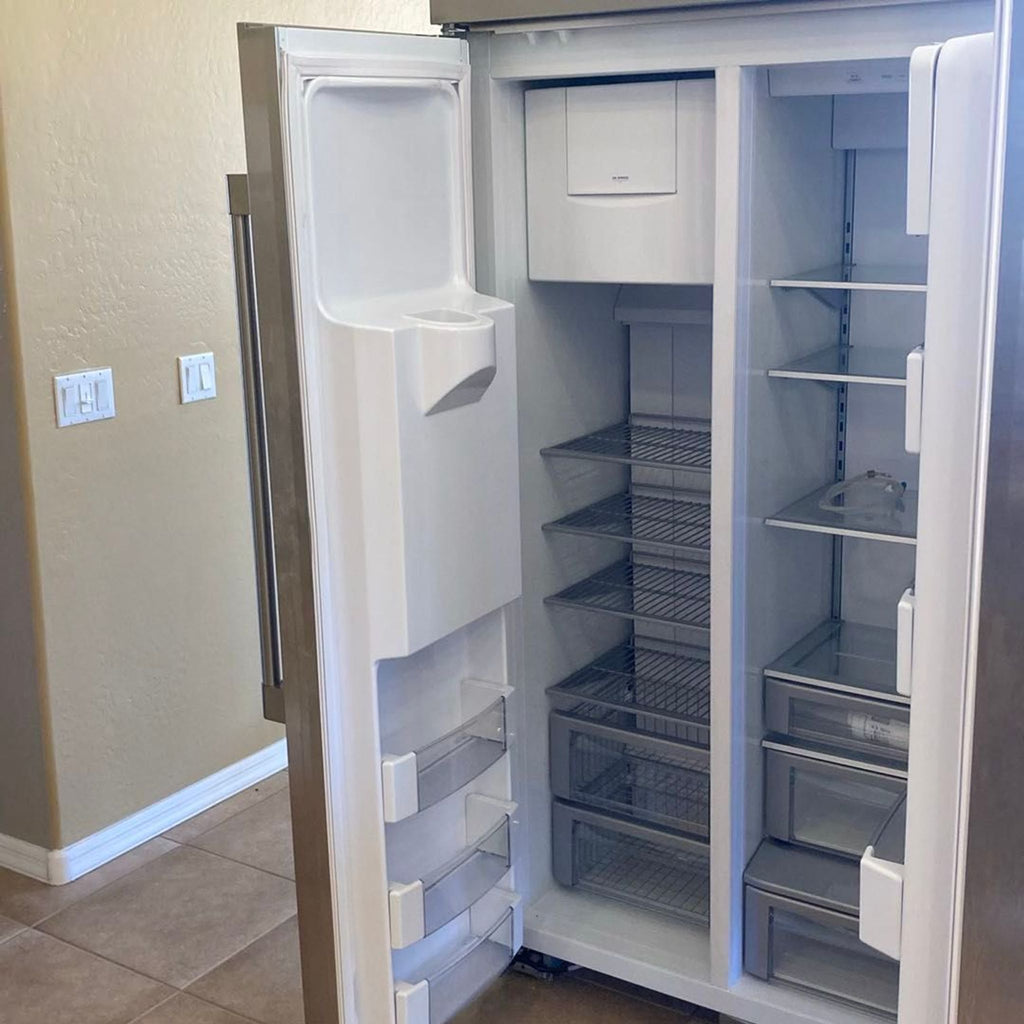 Spacious, well-kept GE Monogram refrigerator with modern design, adjustable shelves, and multiple storage bins.