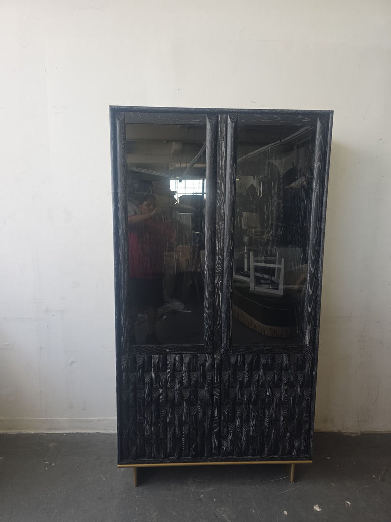 Luxe Showcase entertainment center in black with textured wood panels and clear glass doors, ideal for modern spaces.  