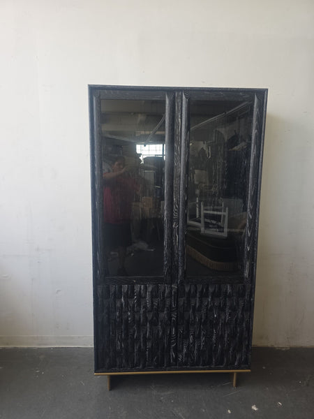Luxe Showcase entertainment center in black with textured wood panels and clear glass doors, ideal for modern spaces.  