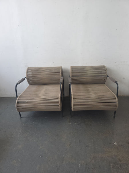 Pair of ELO lounge chairs with black metal frames and woven rope seats, showing minor wear.  