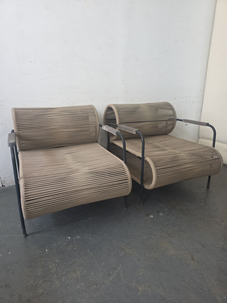 Set of two modern ELO chairs featuring black frames and unique rope seat design, suitable for indoor/outdoor use.  