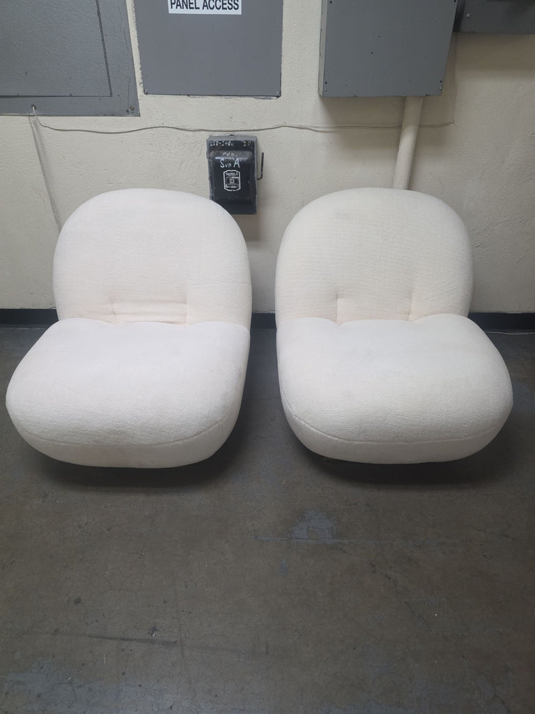 Pair of VIG Furniture lounge chairs with soft cream upholstery and a modern, low-profile design.