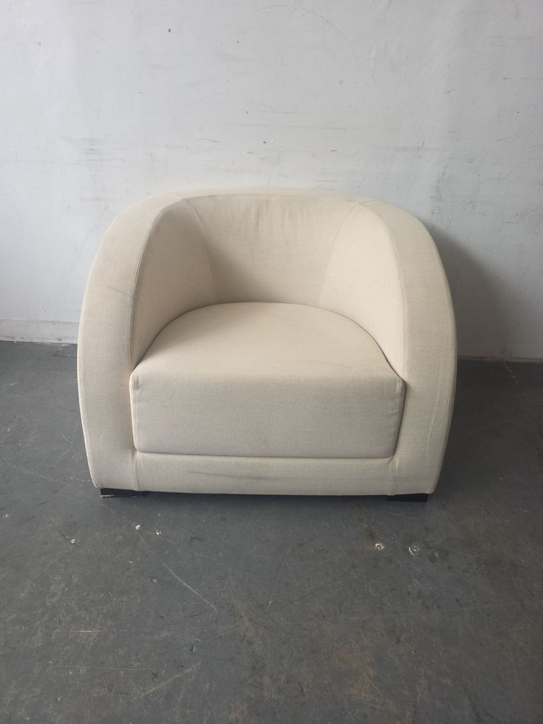 Beige Armani Casa lounge chair with a curved back and modern design, ideal for stylish living rooms.