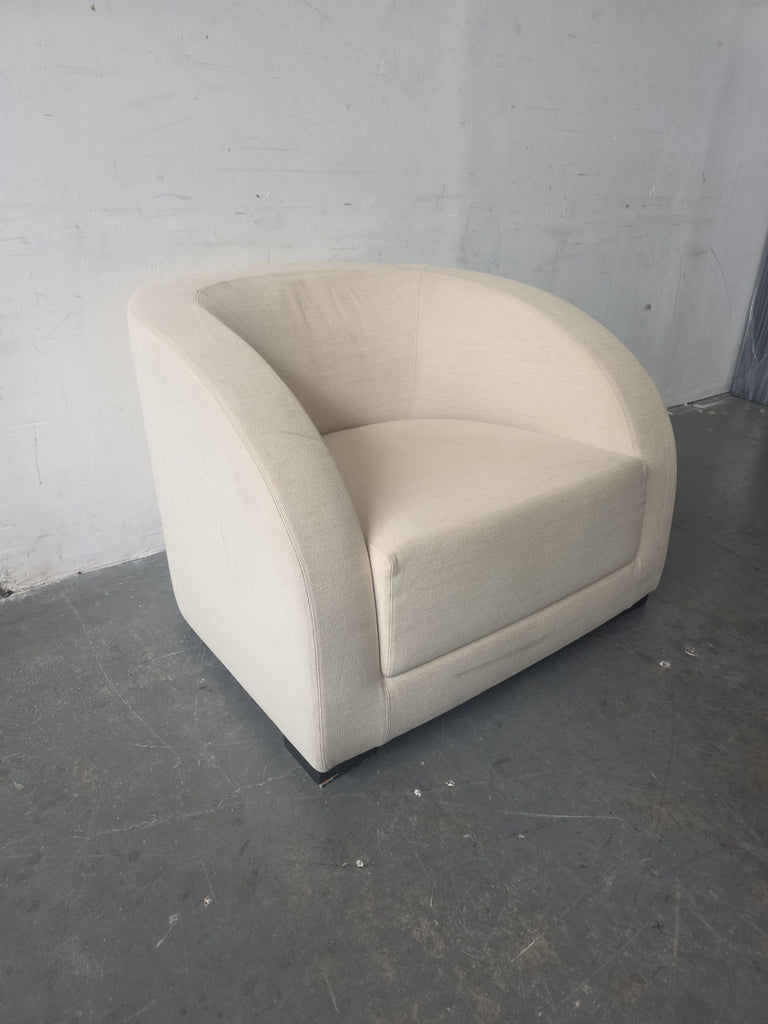 Elegant Armani Casa lounge chair in neutral beige, gently used, perfect for any contemporary lounge space.