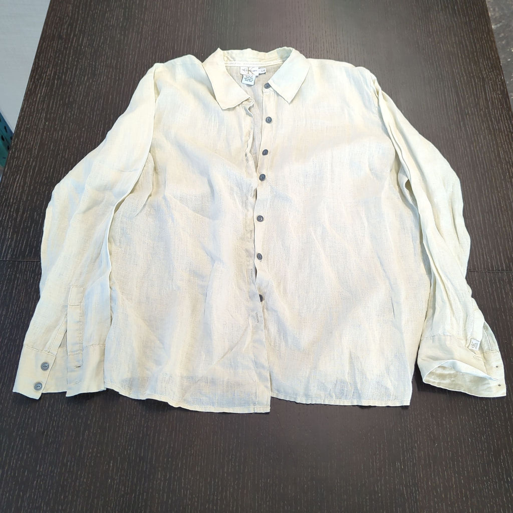 1. Light beige Calvin Klein women's long-sleeve flax shirt with button front, laid flat on a dark surface.