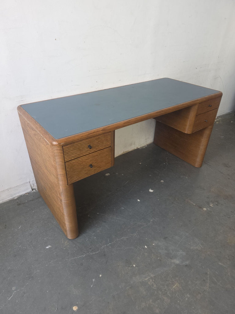 Sleek SOHO Home Wilmot desk featuring a black surface, crafted wood frame, and four spacious storage drawers.