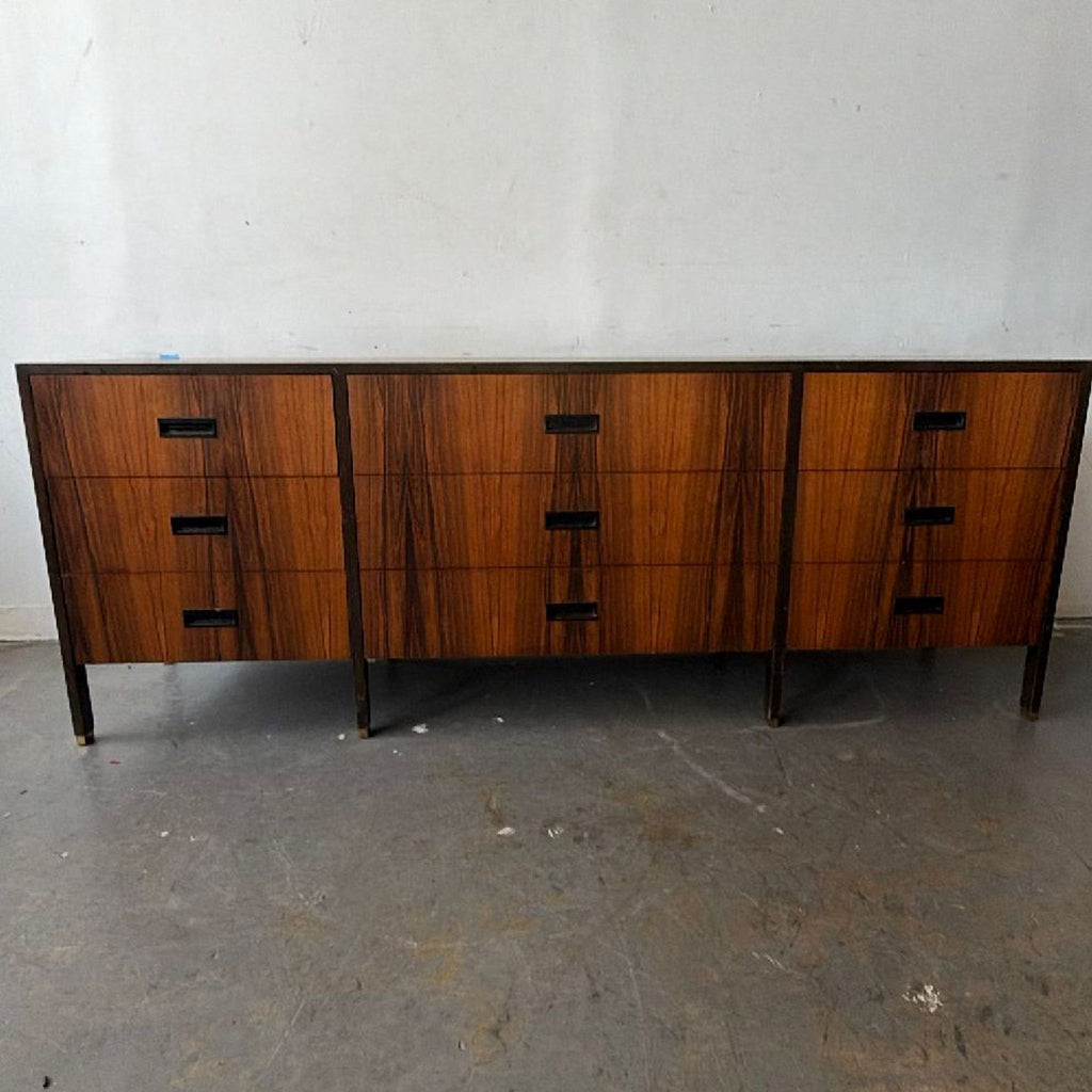2. Sleek Harvey Probber credenza with spacious storage, warm wood finish, and timeless modern design.  