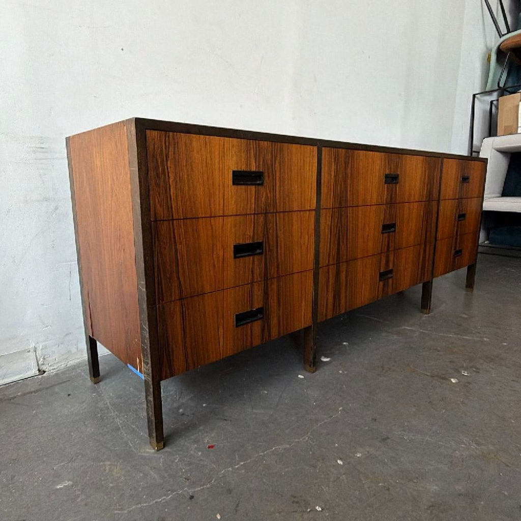 3. Mid-century modern Harvey Probber sideboard, black handles, elegant wood tones, and sturdy rectangular shape.