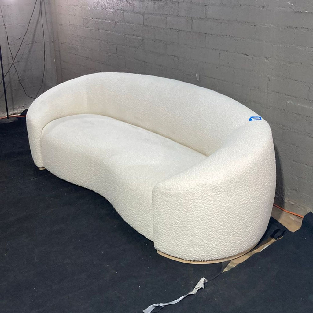 Three-seat Chelsea Sofa with warm, soft cushioning, waterfall seat, and elegant handcrafted ash base.  