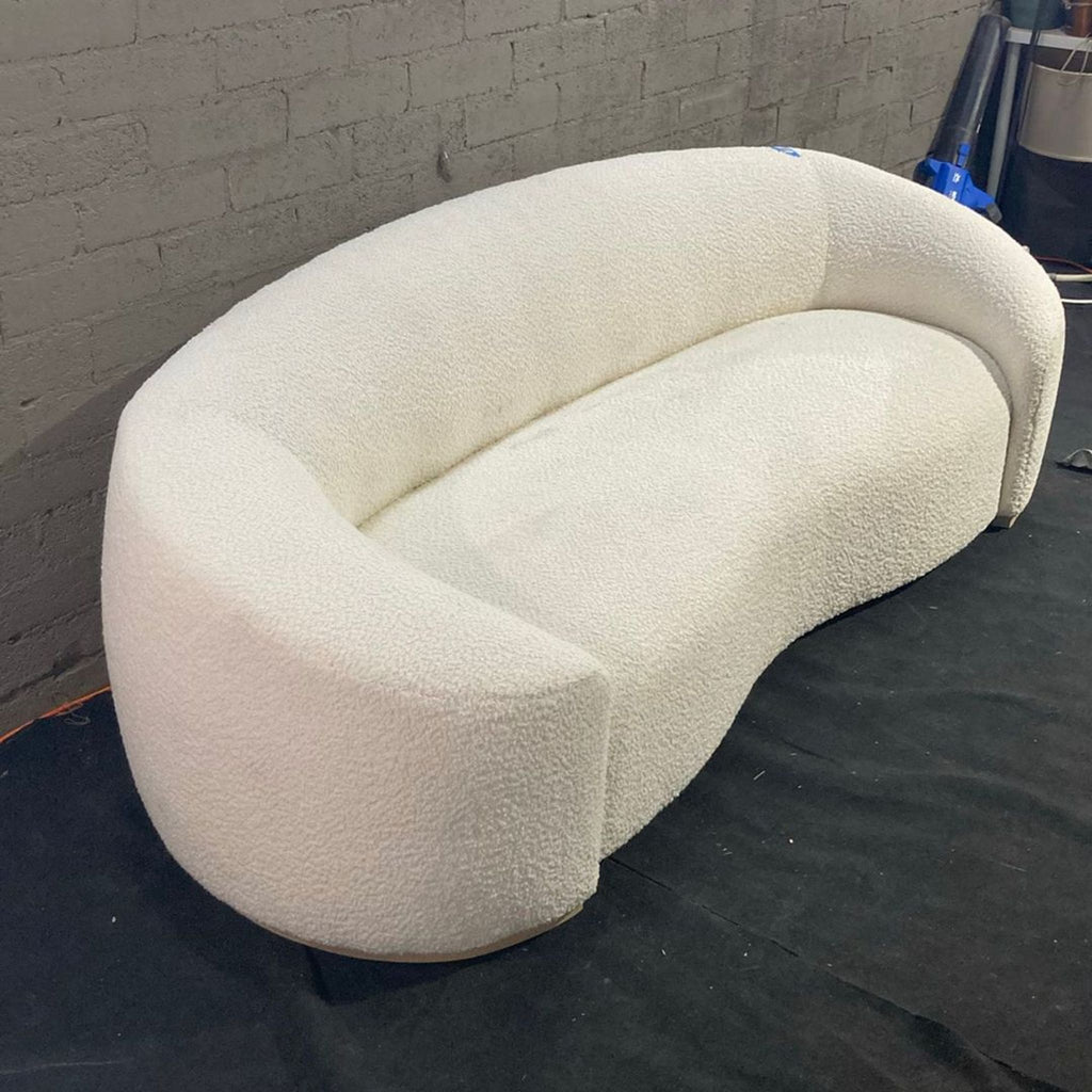 Handcrafted 3-seater Chelsea Sofa with refined tight upholstery, embracing arms, and a sleek ash base.