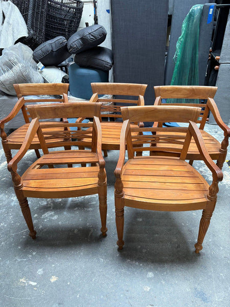 Set of comfortable dining chairs with supportive backs and armrests; one chair shows a missing seat slab.  