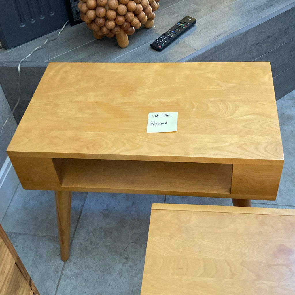 Matching Conant Ball end tables in a modern design, each with a shelf, tapered legs, and a smooth finish.