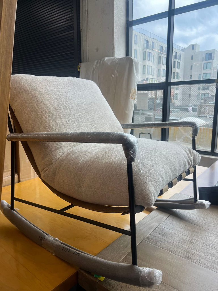 2. Angled photo of Denver Modern Indoor Vail Rocker with protective wrapping, oat fleece upholstery, and black frame.