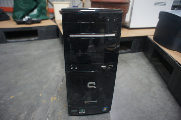 1. Front view of a Compaq CQ5205Y PC tower with visible brand logo and drive bays.