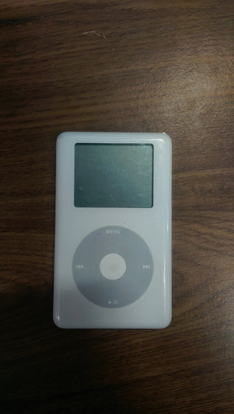 1. Front and back view of a classic white Apple iPod, a gaming device, on a wooden surface.