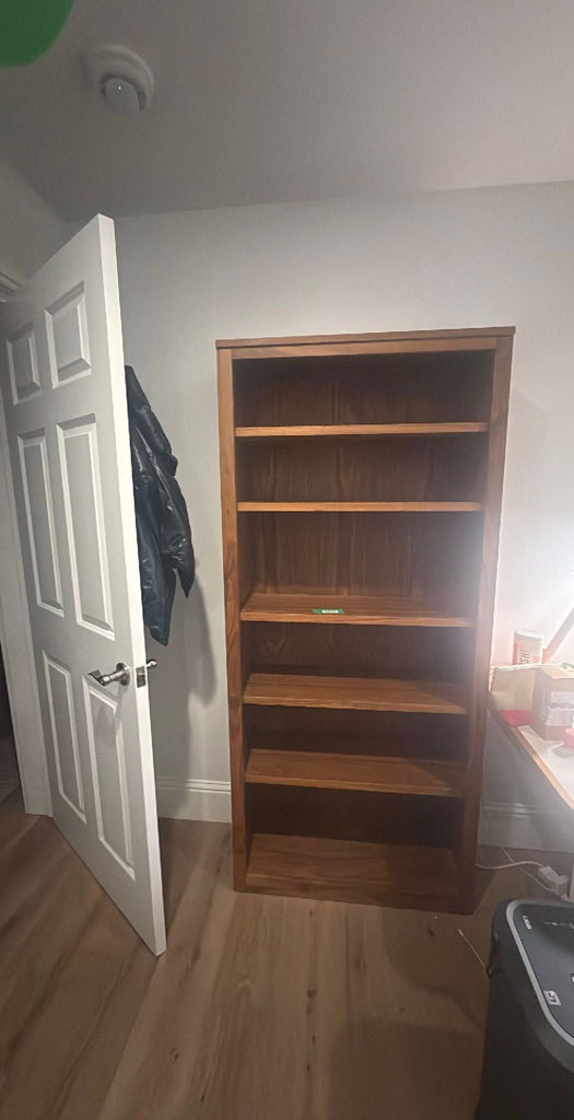 1. Modern Room & Board bookshelf with open shelves, ideal for books and decor display.
