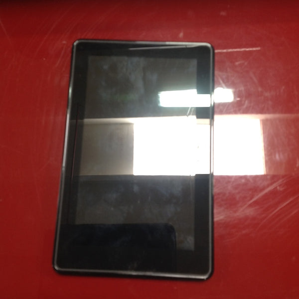 1. Amazon Kindle tablet with a black screen, placed on a red surface, category Phones/Tablets.