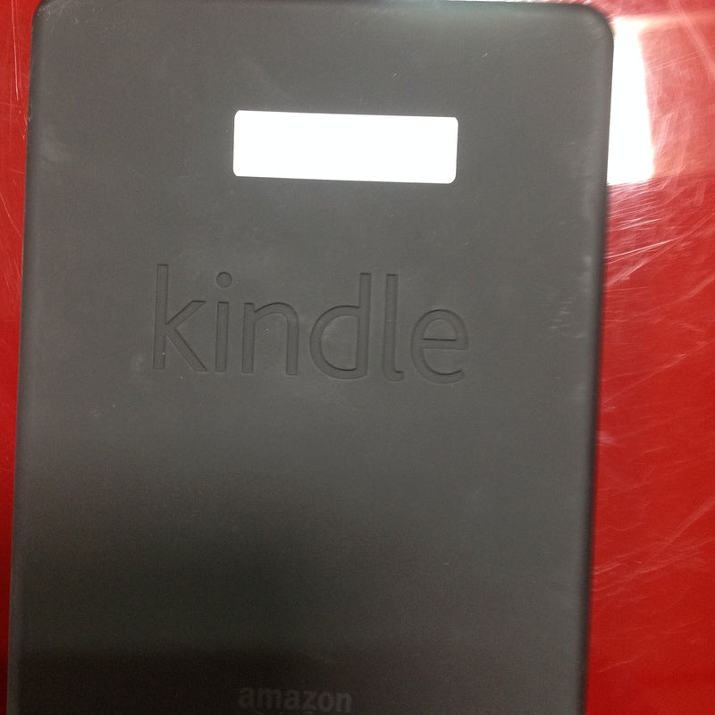 3. Black Amazon Kindle backside showing the embossed logo and a white label, classified as Phones/Tablets.