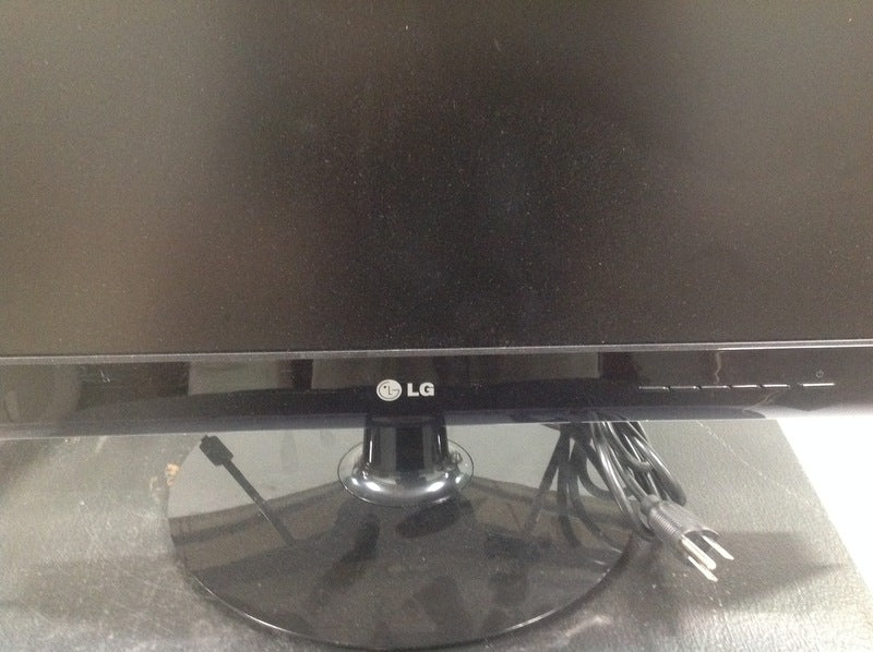 2. Close-up of the LG Flatron monitor base and power cord, showcasing the LG brand logo on the bezel.