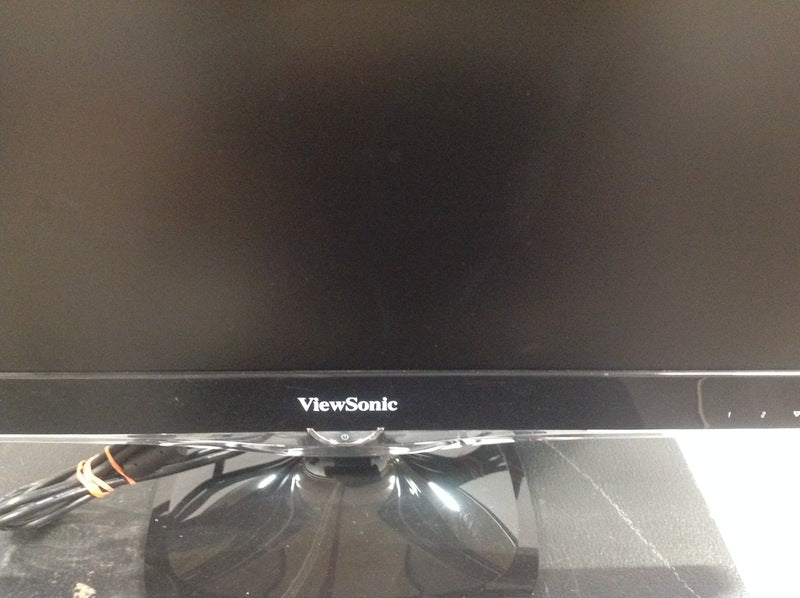 2. Close-up of the Viewsonic logo on the bezel of a monitor, with part of the screen and stand visible.
