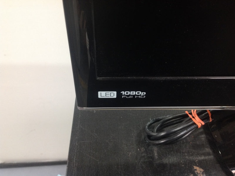 3. Detailed shot of the lower corner of a Viewsonic monitor showing "LED 1080p Full HD" label and power cord.
