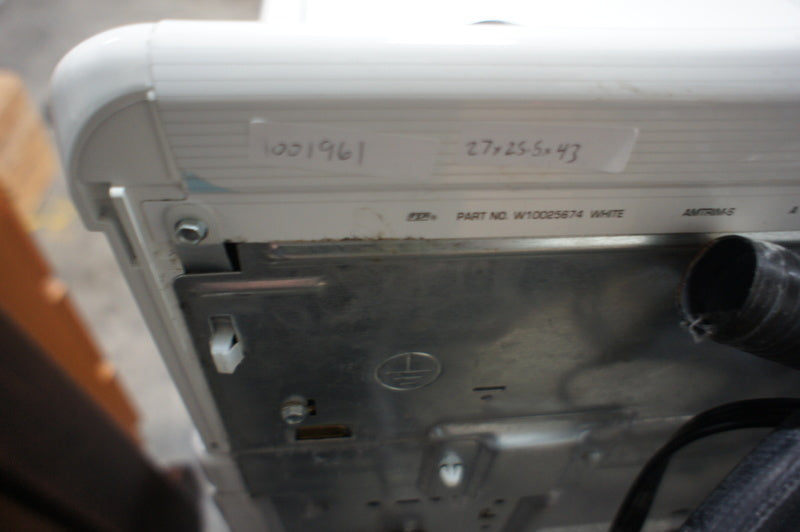 2. Close-up of a white Kenmore washer's back panel, displaying model and part number information with hoses attached.