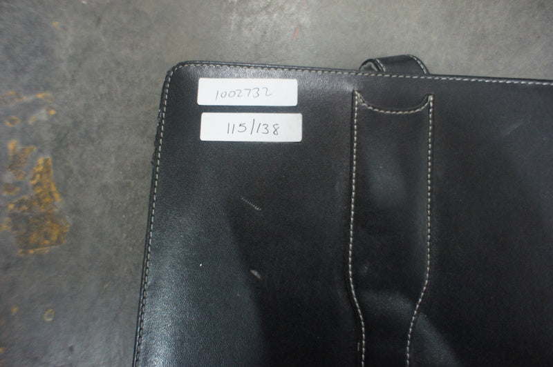 2. Close-up of a black case with white labels showing numbers, belonging to an Amazon Kindle tablet.