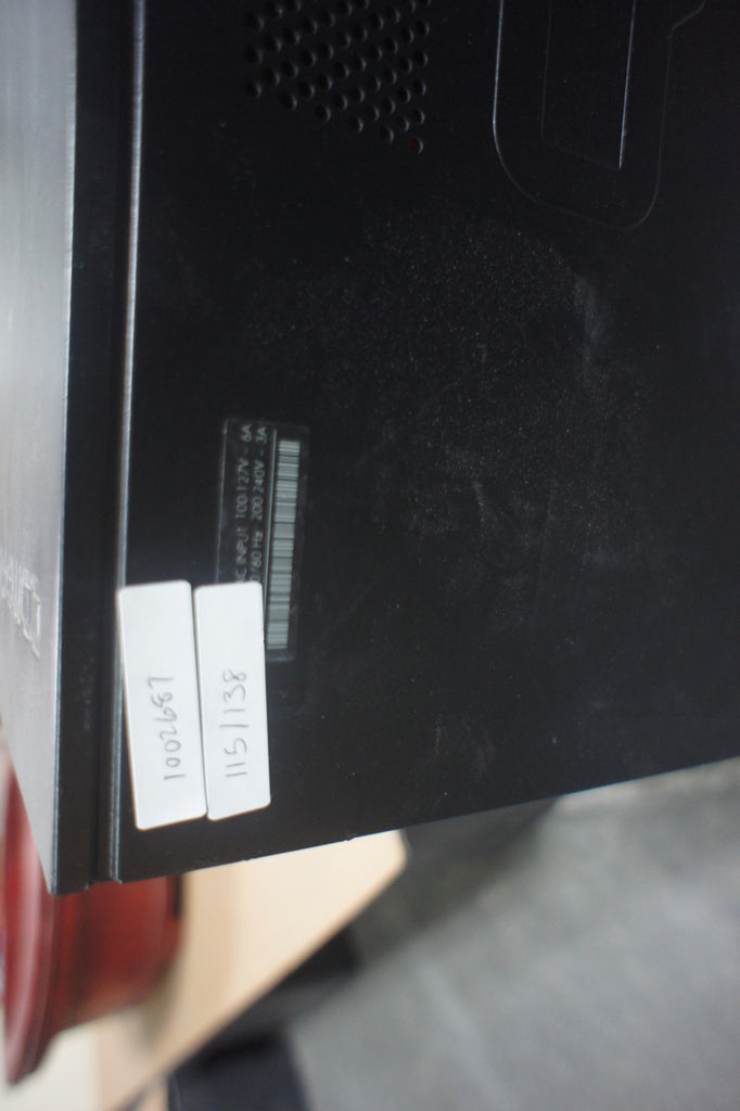 2. Close-up of the side panel of a Compaq CQ5205Y PC, showing stickers and a barcode label.