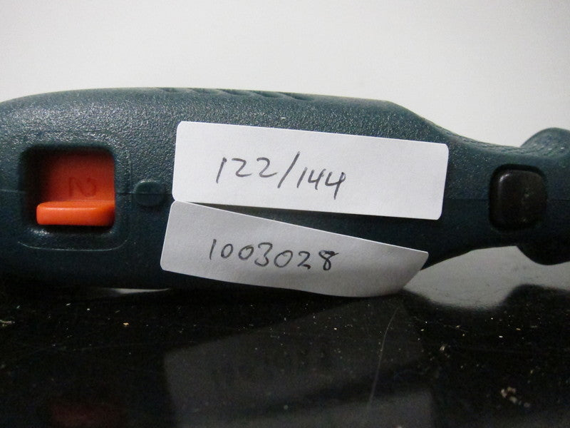 Close-up of Black & Decker Wizard Rotary Tool handle with orange switch and handwritten labels attached.  