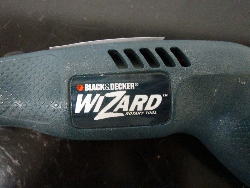 Zoomed view of the Black & Decker Wizard Rotary Tool brand logo and textured handle details.