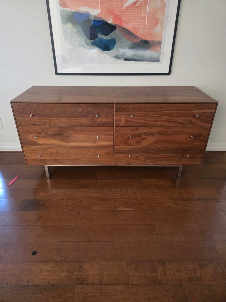 1. Modern Room & Board walnut dresser with six drawers and metal legs, shown against a white wall with artwork.