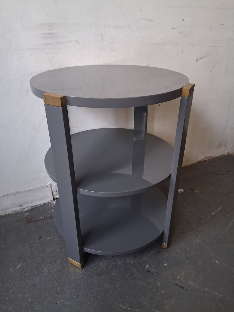Sleek side & console table in glossy gray, three tiers, brass corners, ideal for contemporary spaces.