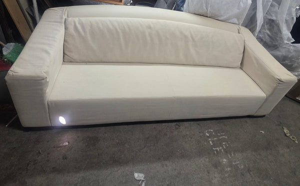 Armani Casa 3-seat sofa with cream upholstery and modern design, showing minor wear but overall in good condition.
