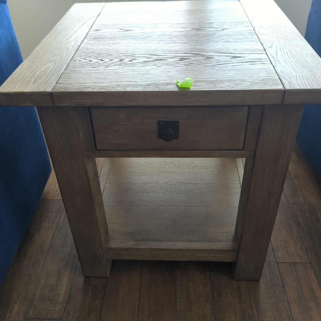 2. Furniture Pic 1 branded end table from 2019, featuring a compact build ideal for living rooms.  