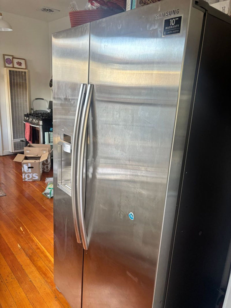 Compact single-door refrigerator, white finish, suitable for small kitchens or dorm rooms.