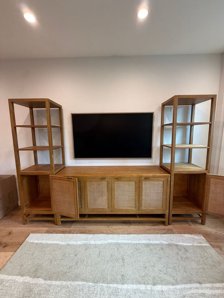 2. Wooden Crate & Barrel Entertainment Center with side shelves and cabinet doors partially open under a wall TV.