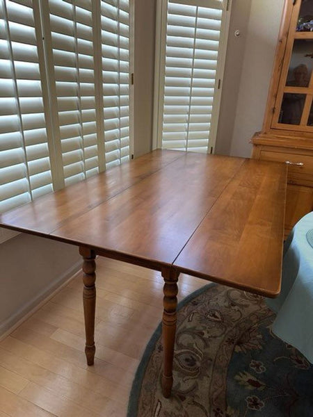 a wooden table with a wooden tablecloth on top of it 