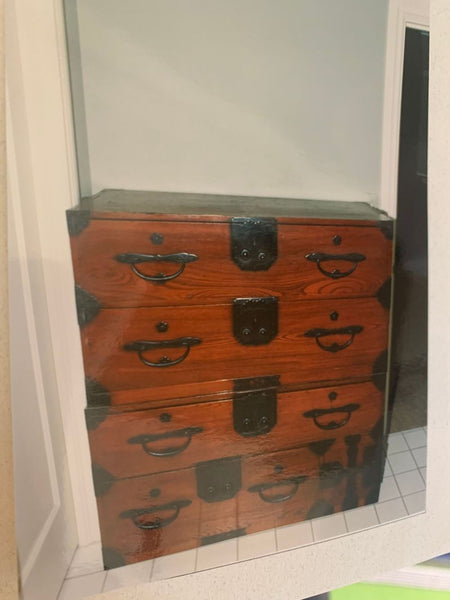 1. Antique wooden dresser with black metal accents and handles, featuring four drawers and a rich wood finish.