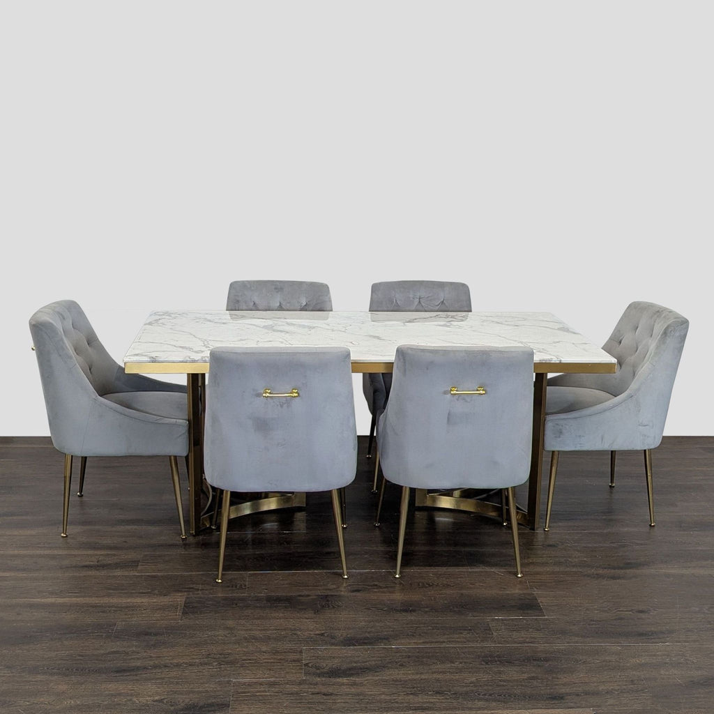 Modern Wayfair dining set: rectangular marble-style table, gold metal accents, and six tufted gray chairs.