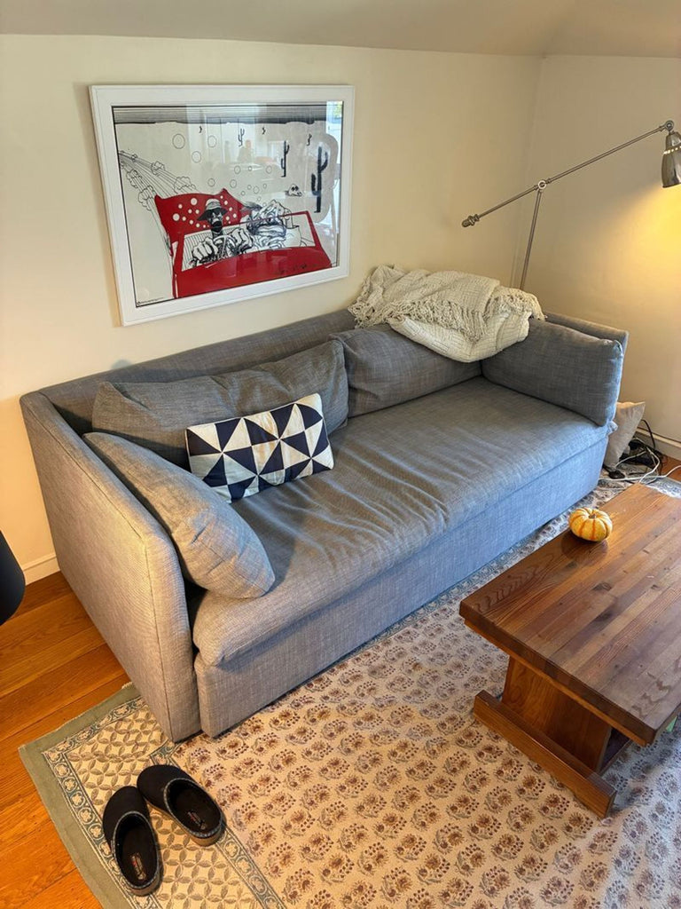 2. Contemporary 3-seat Marin Sofa by West Elm, plush cushions and low-profile arms, neutral color scheme.  