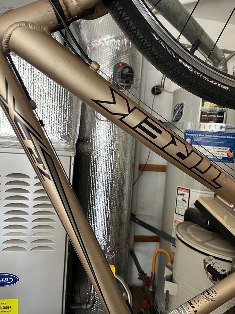 3. Trek 7.2 FX sports bicycle shown upright, highlighting frame and tires, suitable for active use.