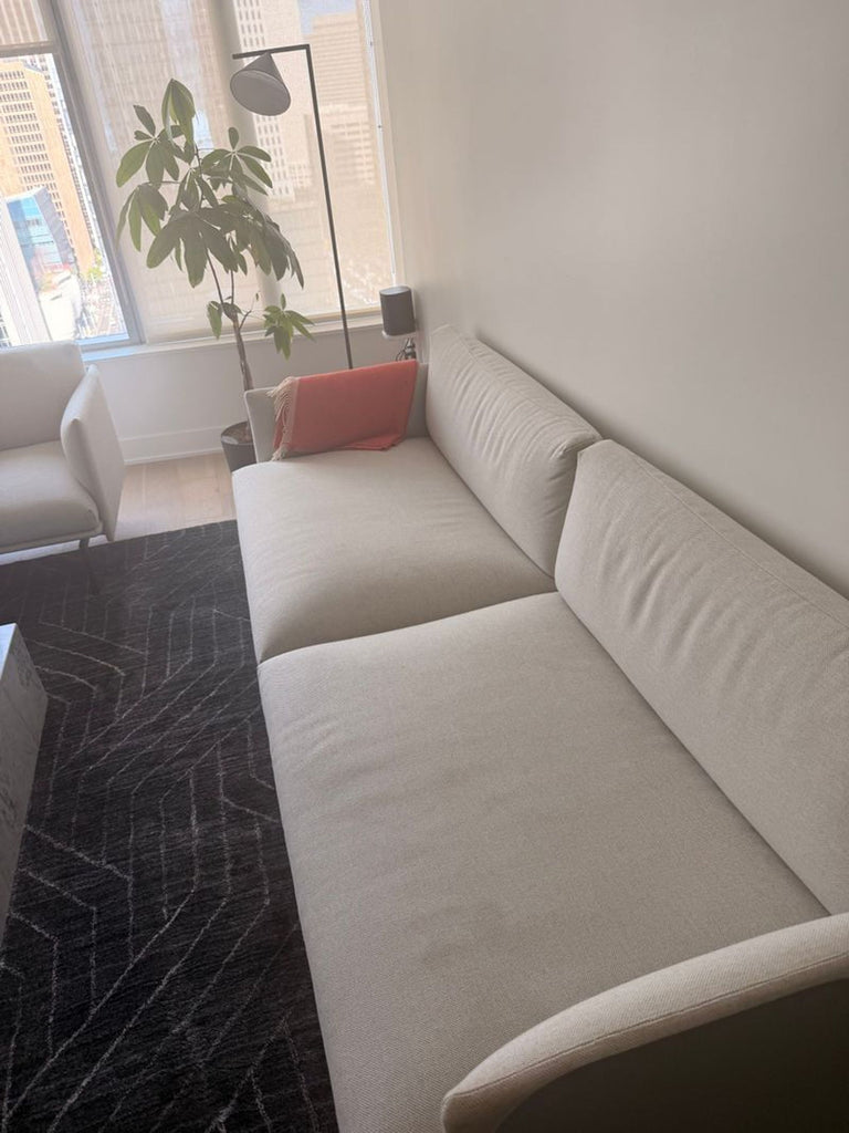 1. Modern Outline loveseat from DWR with minimalist design and soft gray upholstery.  