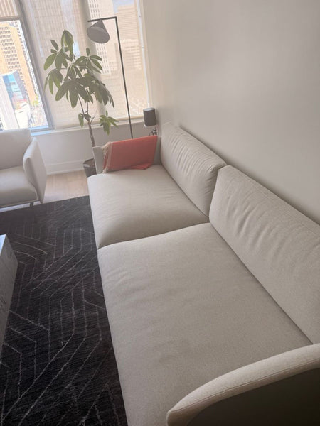 1. Modern Outline loveseat from DWR with minimalist design and soft gray upholstery.  