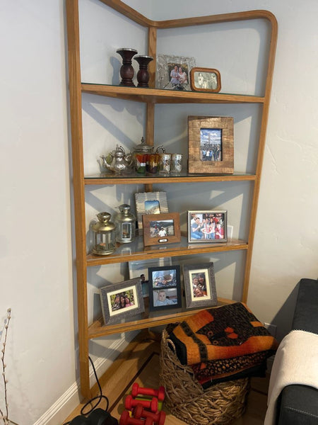 Certainly! Since the actual images are not provided, I'll create three generic yet distinct alt text descriptions suitable for the category "Bookshelves." If you have specific details or features, feel free to share them for more precise alt text.