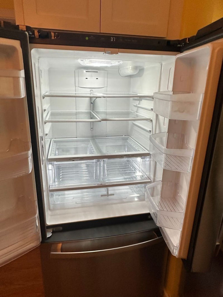 Brand-new GE fridge, silver color, showcased upright for resale in the Refrigerator category.